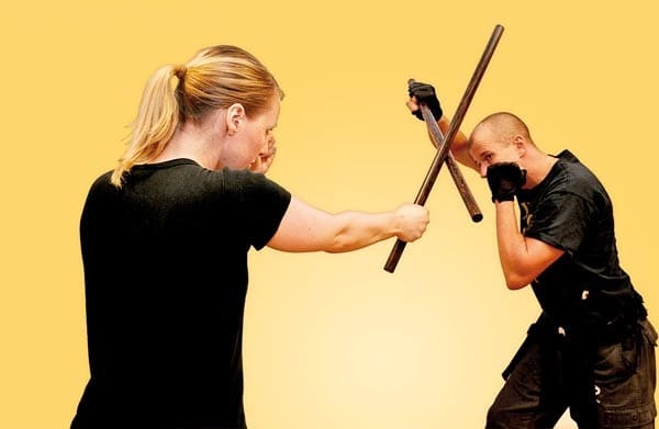 Here you see two practitioners of Eskrima, the defender demonstrating a "roof block", the attacker delivering what is commonly called a "1 line" in many systems.