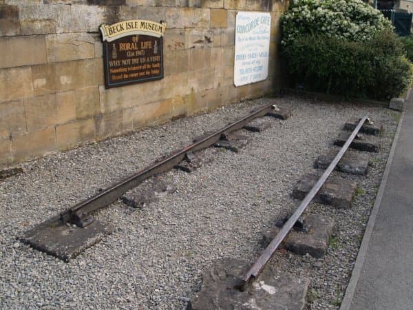 A section of original W&PR 'fish-belly' rail found at Pickering Station - this has been embedded within the station wall by the southern end of the rails at Pickering Station
