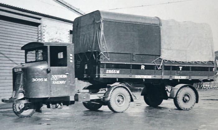 A 1936 Southern Railway-owned Scammell 'Scarab' mechanical horse, a three-wheeled tractor unit for tight curves with fittings to take a divers range of two-wheeled trailers and release them for unloading at clients' premises