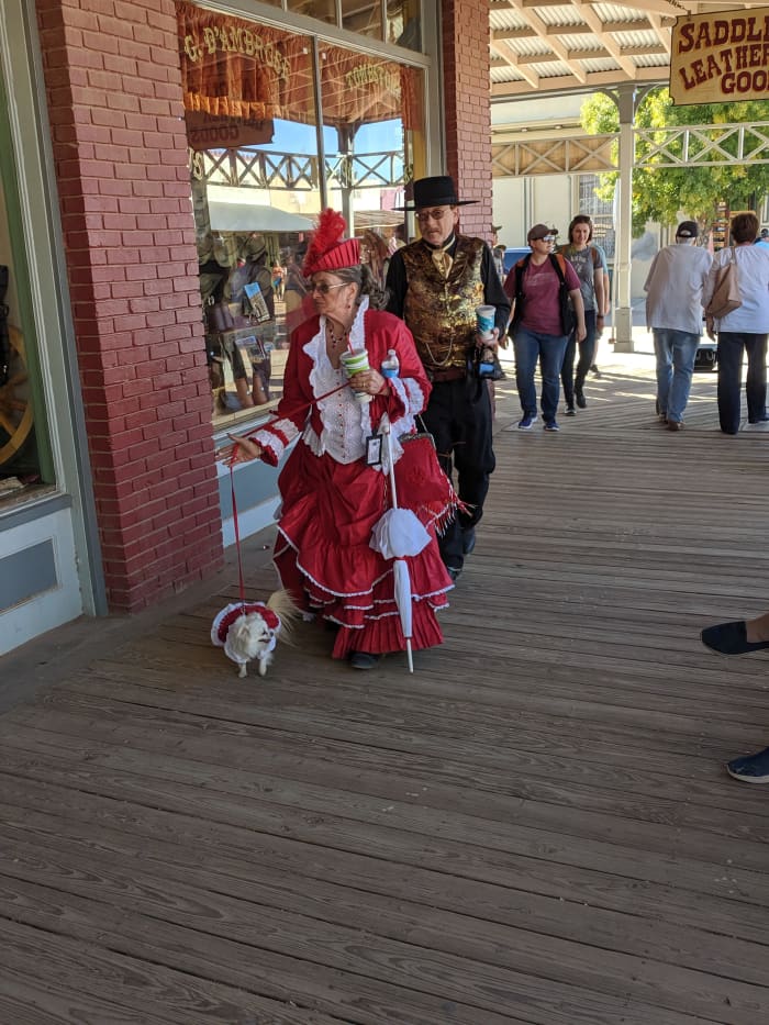 This couple and their dog, all elegantly dressed in period clothing travel frequently from their home in Nevada to participate in Tombstone festivals.