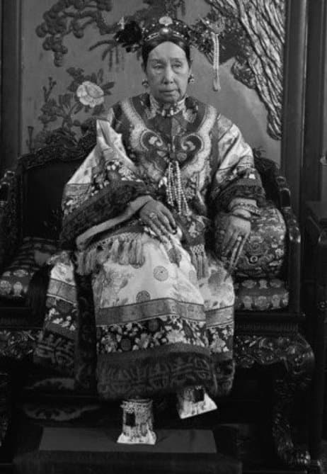 CiXi and her square cut shoes. Most of her court shoes looked uncomfortable in a number of pedestal heel designs but she also wore moccasin type shoes.