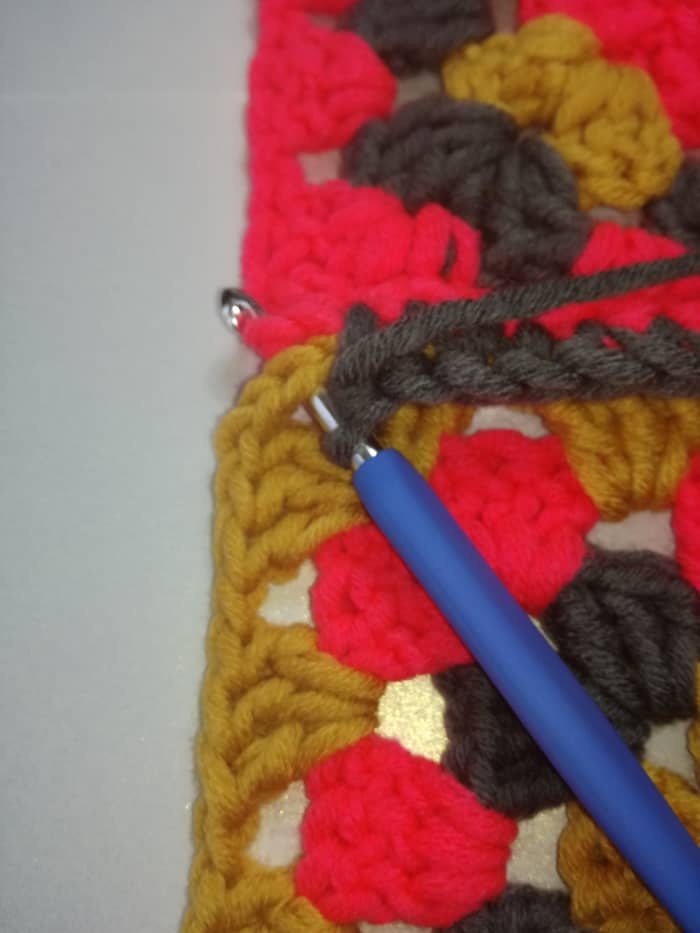 Image 3. When you get to the end of the row insert hook in the first stitch of the 2 chain corner and make the last double crochet.