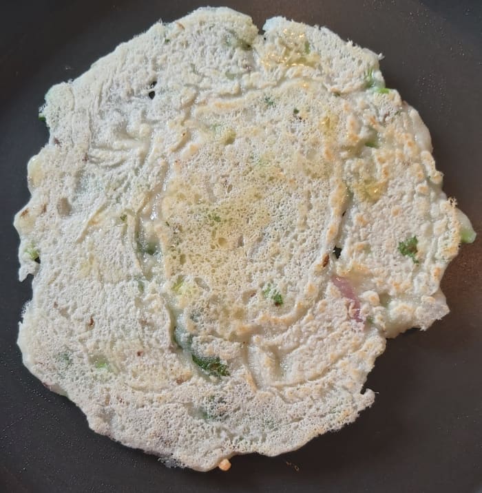 Flip over and cook on both sides on medium flame till golden spots appears. Repeat the same procedure for remaining batter.