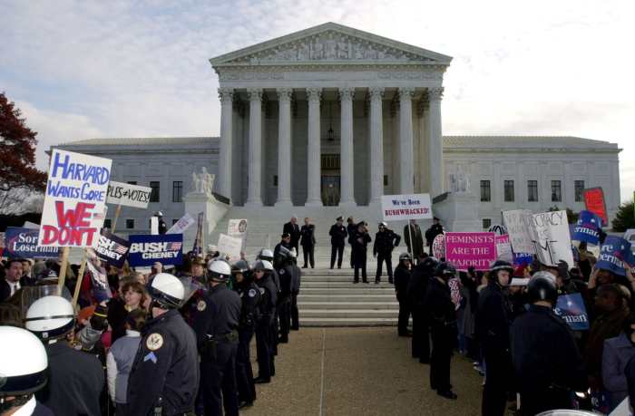 Supporters of George W. Bush and Al Gore gather in front of the US Supreme Court on December 1, 2000, only 11 days before the ruling of the landmark case Bush v. Gore was announced in a 5-4 decision
