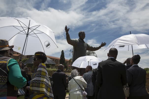 A statue of former South African president Nelson Mandela is unveiled at the Union Buildings in Pretoria on Dec. 16.
