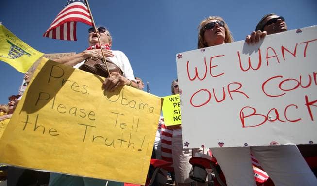 Just because Obama is President, now the Tea bagger 'want their country back... as their signs depict..