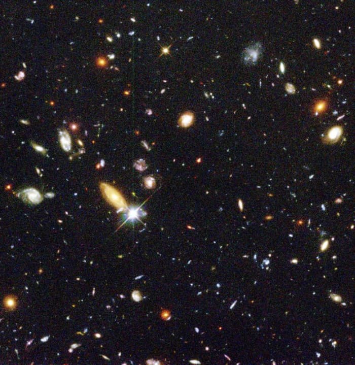 The Deep Field Image taken by the Hubble Space Telescope. Because light from these galaxies takes so long to reach us, we are looking back in time to the very beginnings of the Universe. But space is not as crowded as this image makes it appear...