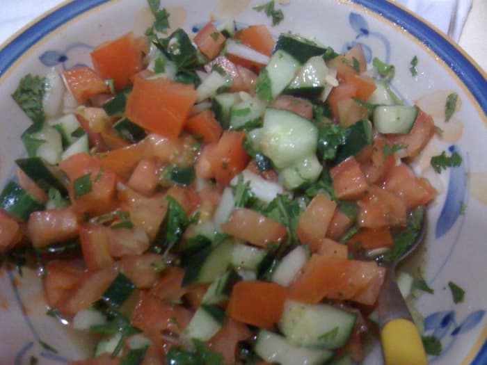 Lime juice provides flavor for accomaniments like this salad which contrasts with bland tasting foods like beans and rice.