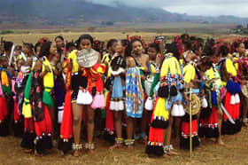 Swazi girls in the festival and celebration of the reeds dressed in their colorful traditional dress