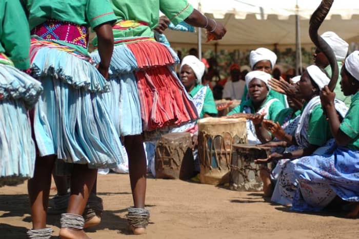 Shangaan women drummers and dancers in traditional clothes and drum singing traditional and dancing traditionally to music of their culture