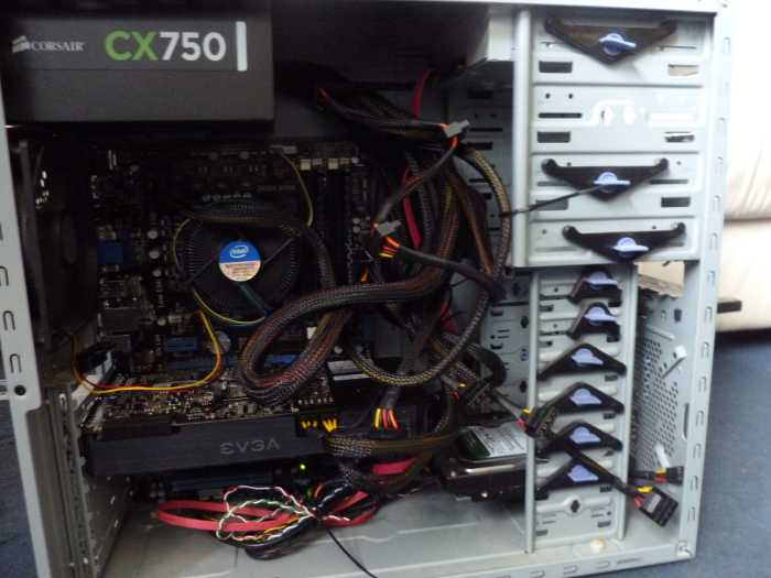 The inside of a desktop computer. The processor, graphics card, RAM, hard drive and everything else neatly fitted together via the motherboard.