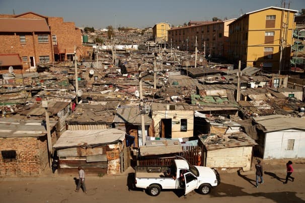 The South African township of Alexandra, shown above, is next to the wealthy suburb of Sandton, an example of post-apartheid South Africa’s vast gulf between rich and poor.