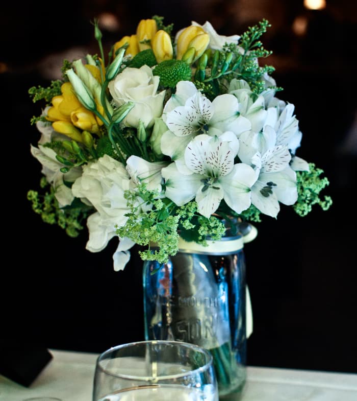 Mason jars make whimsical vases for real or fake flower bouquets.