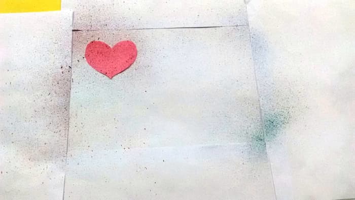 Cover the margin with regular papers and use paper cutouts of your choice. Here I have used a Heart.