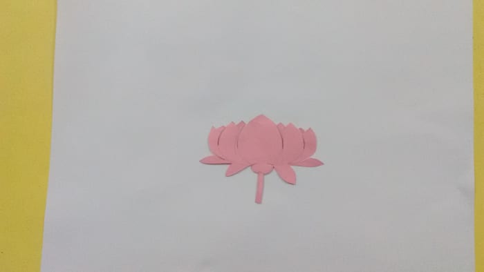 Let us use a flower cutout for spraying. Draw a lotus on a paper and then cut it out from the paper.
