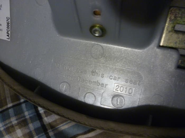 This car seat has a difficult-to-see expiration date - stamped into the plastic is the warning, "Do not use this car seat after December 2010." Click to enlarge.