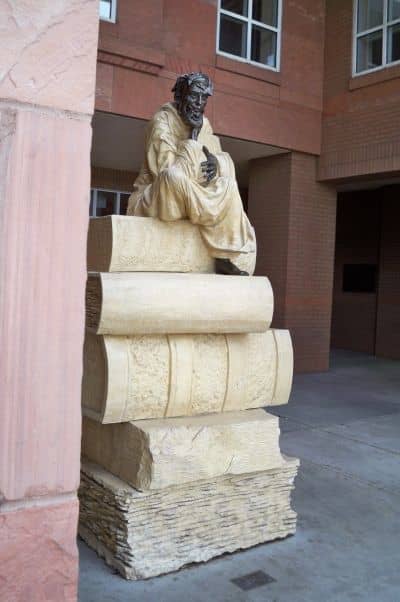 An untitled bronze and limestone sculpture by Peter Parkany, 1996, located outside NAU's Cline Library