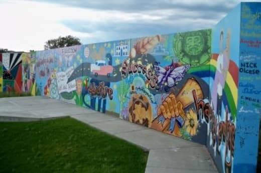 A mural on behalf of Literacy Volunteers -- "Reading is the road to freedom, adventure, success, happy endings."