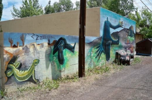 A surreal mural in a Southside neighborhood alleyway (Love the added touch of the old couch someone dumped in front of it.)