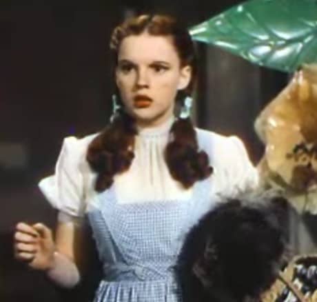 Judy Garland's face doesn't look very long in the Wizard of Oz. With a close-cropped style around her head, her braids fluff out over her chest--this makes her face look round, like that of the young girl she's playing.