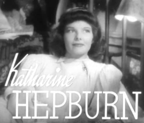 Not the best look for Katharine Hepburn. This 1937 hairstyle is too symmetrical, emphasizing the almost masculine geometry of her face. The bangs add to the flat top look and shorten her forehead.