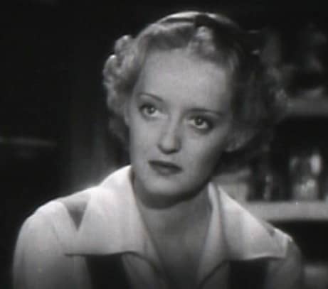 Bette Davis wears a cropped style to stop the eye before it goes down the length of the face in one fell swoop.