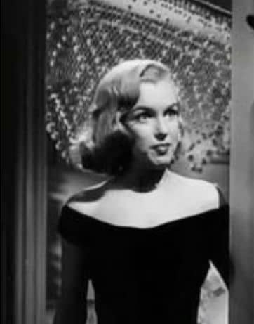 Guess who? Marilyn Monroe again, and not the most flattering look, as the length of her hair is almost exactly the length of her face and the style is too close to her face.