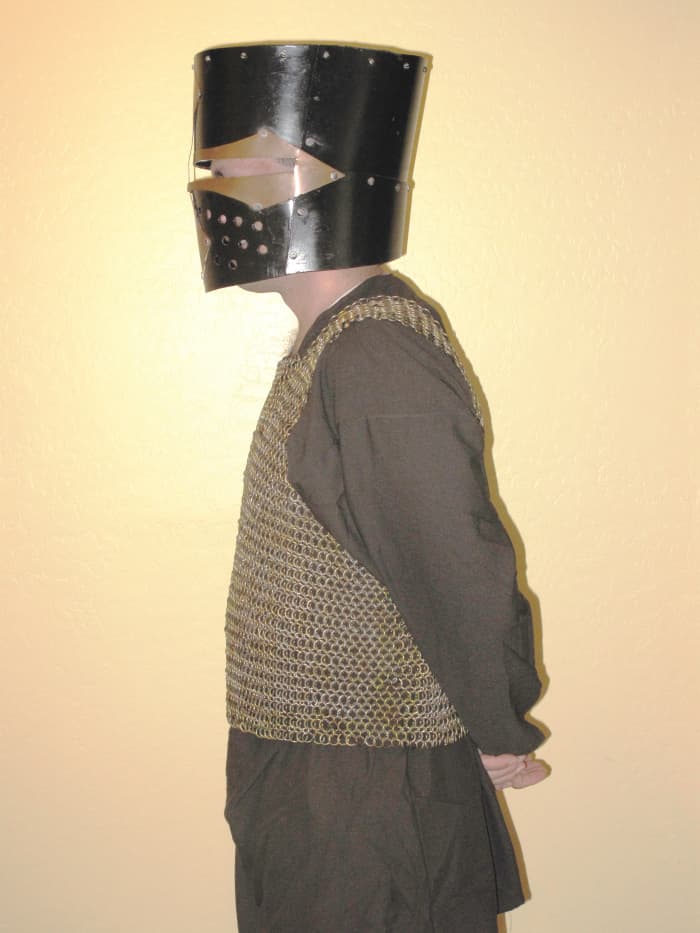 This is the chainmail shirt my husband is working on. It weighs 30 pounds. The helmet weighs about 10 lbs.