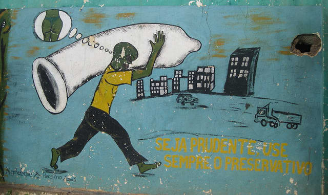 AIDS awareness painting on wall in Chimoio town, Mozambique. The text reads: "be carefull, always use a condom"