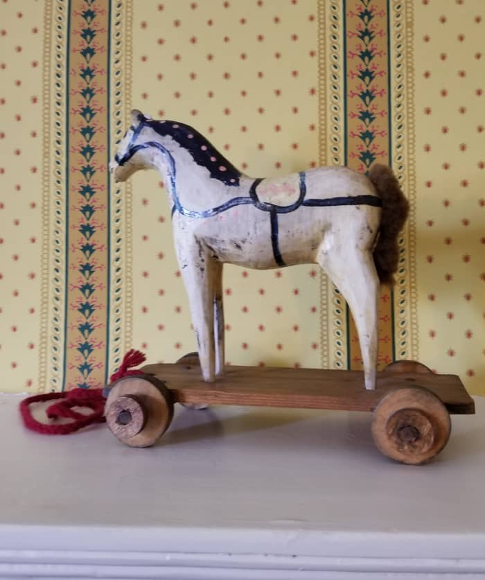 A toy from a store or one carved by a family member. This one is a pull toy, but horses also were made into rocking horses to ride on.