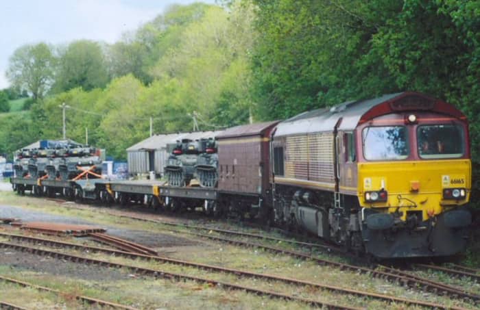 Back to reality, a modern loaded warflat train with a transfer freight between military bases (Hush-hush! Top secret!)