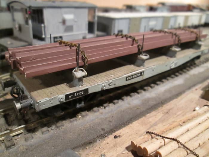 British Railways re-liveried many of the WD Warflats for conversion to carry steel stock and engineering steel from the many steel plants