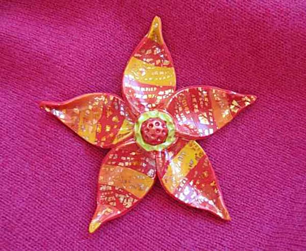 An example of my fun, colorful, inexpensive and easy to make polymer clay fantasy flower pin from my step-by-step jewelry making tutorial.
