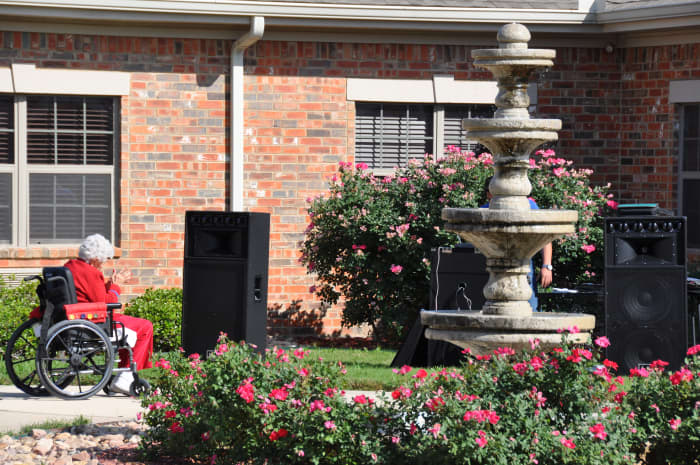 San Antonio nursing home/long term care facility with fountain and beautiful landscaping. Notice they are setting up for music entertainment!