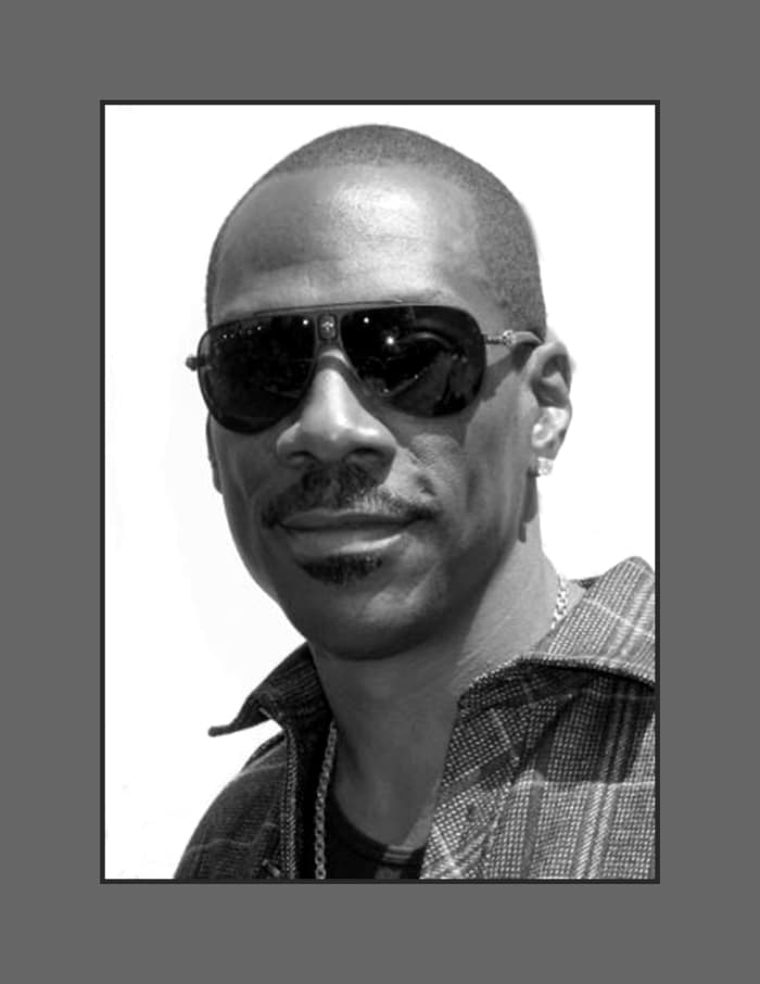 Eddie Murphy chose the buzz cut hair style to take away the focus on his thinning hair and receding hairline. - 2013 Hairstyles for Men with Balding Thinning Hair Style Cuts Trends