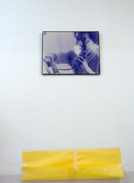 The photograph of Swami with the stethoscope in a ward at Sathya Sai General Hopital which was exuding vibhuti from 8 feet above the ground! A yellow 'collection paper' had been fixed below.