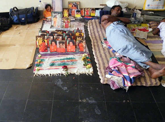 The footsteps lead to this altar where every volunteer had placed a photograph of his choice...