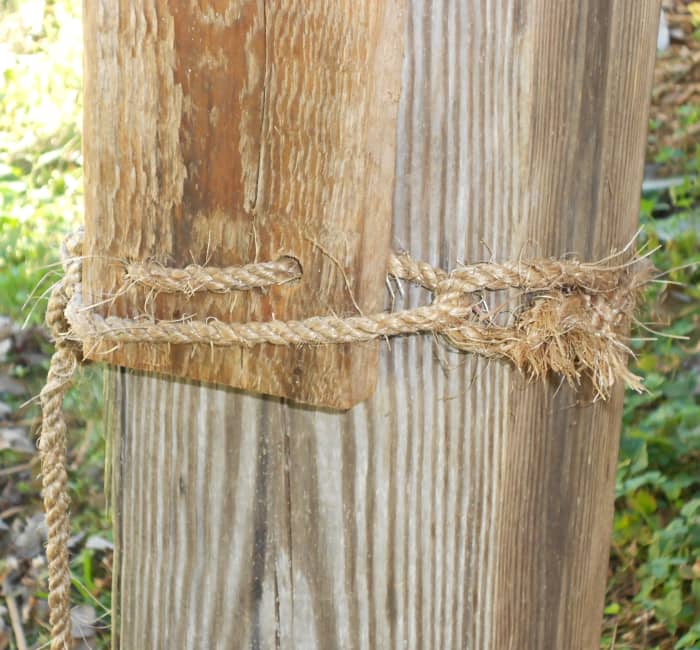 I mount these birdhouses with a piece of sisal rope I push through two holes in the mounting board. Then I tie the birdhouse to a tree, post or to this deck support without any damage.