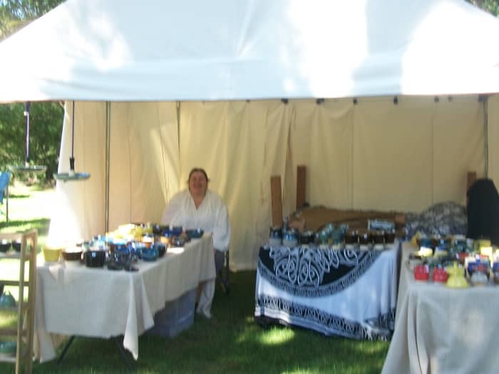 she actually makes the pottery on a real foot pedal spinning wheel and sells her pottery at these events.