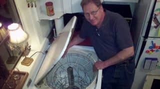 Mike Haller, the owner of the largest collection of antique dishwashers in the US, inspects a Youngstown Electric Sink in my kitchen.