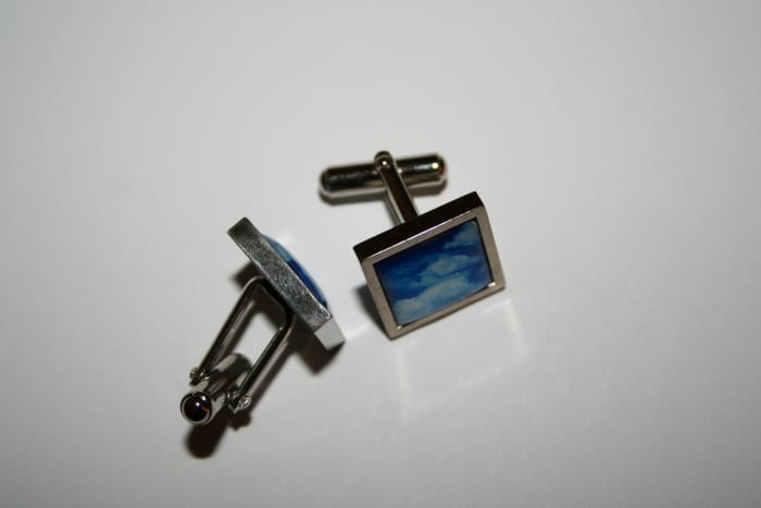 During the Art Deco period, men often wore cufflinks with large geometric stones.