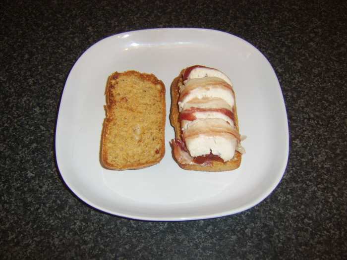 Chicken breast stuffed with sun dried tomatoes, wrapped in pancetta and served as a sandwich in a sun dried tomato ciabatta roll