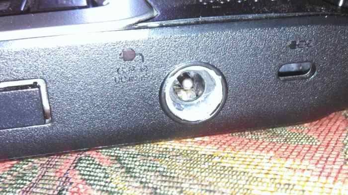 I used glue to repair the power adapter instead of replacing the motherboard in my laptop