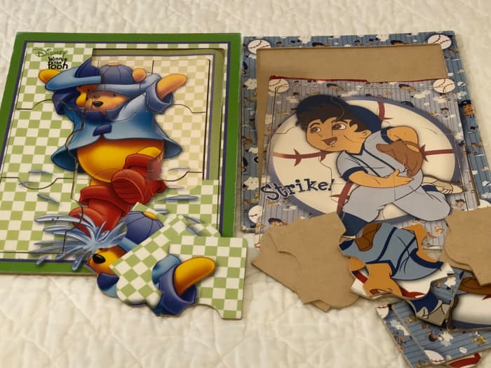 I took pictures of the assembled puzzles with my phone, printed, then trimmed to size for the puzzle board.