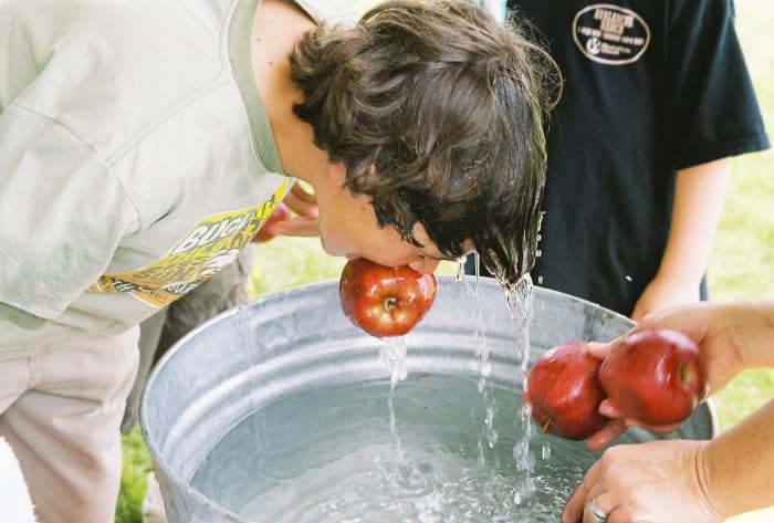 Bobbing for apples, often has the germ factor as well as the wet hair factor. There are some great alternatives!
