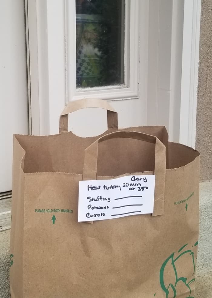 Coordinating Thanksgiving meal preparation and seeing your friends from afar when you pick up everyone's contributions can help make the holiday more festive.