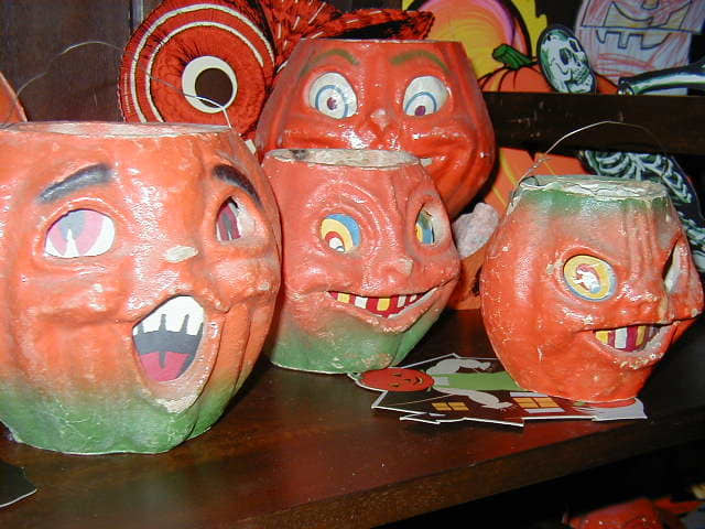 Whether those pumpkins are grinning or scary, they are amazingly expensive if they are not reproductions.