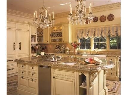 Old World design options showcased in glazed white kitchen cabinets with extensive moldings, plate racks and double chandeliers