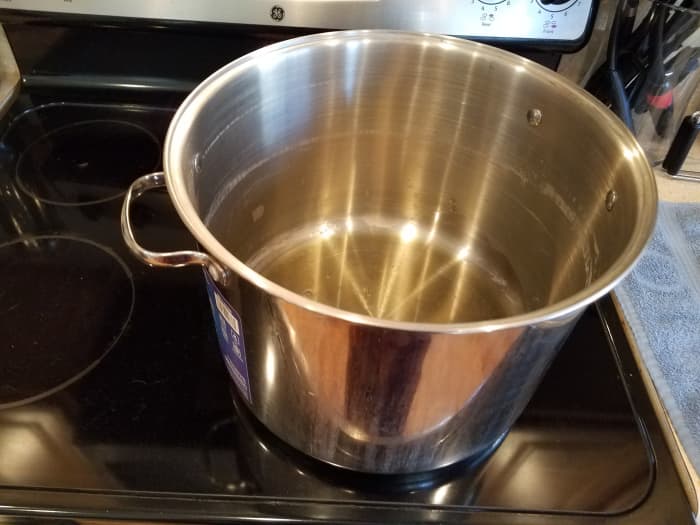 Step 3: Add about 1/4 cup of olive oil tot he bottom of your pot. It's important that's it's olive oil for the taste of your pasta sauce.