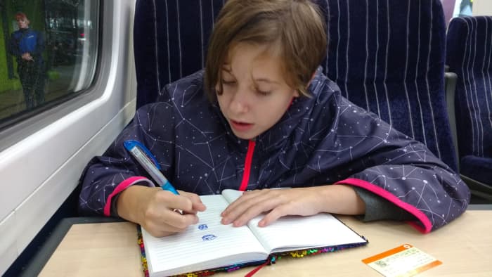Our granddaughter Josie on train ride back to London from York, very early one morning on this second journey to the UK.